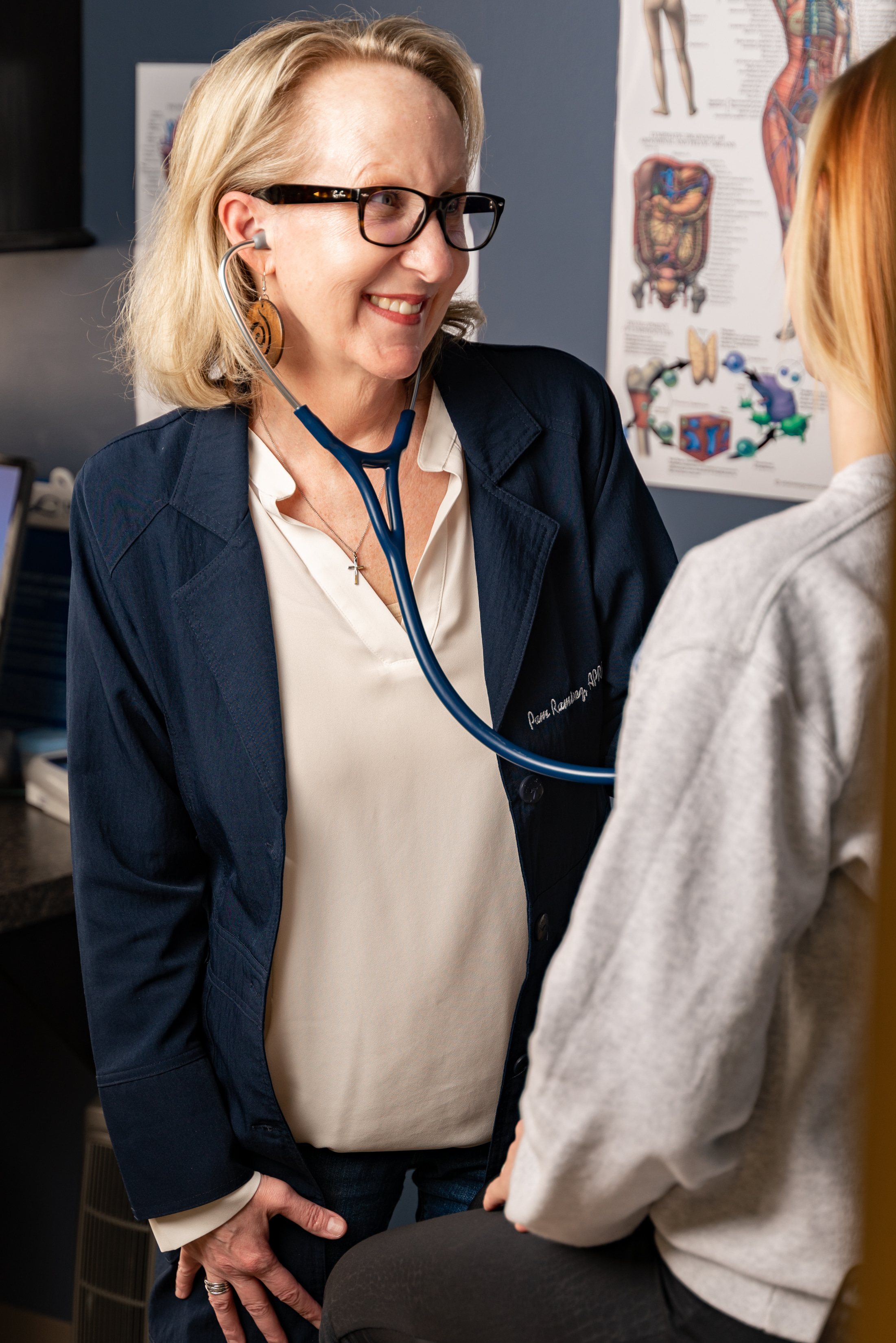 Provider performing a physical exam at Paragould Family Care